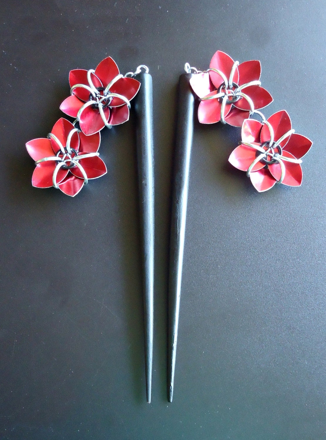 Pair of Black Six Inch Wooden Hair Sticks with Metallic Red Flowers