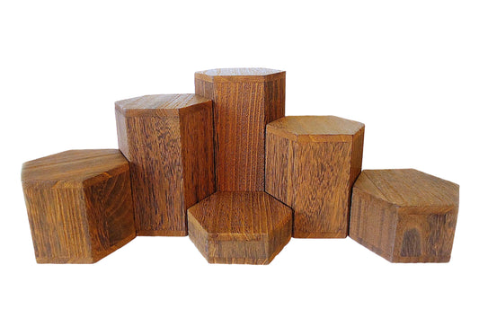 Set of hexagonal brown wooden blocks on a white background