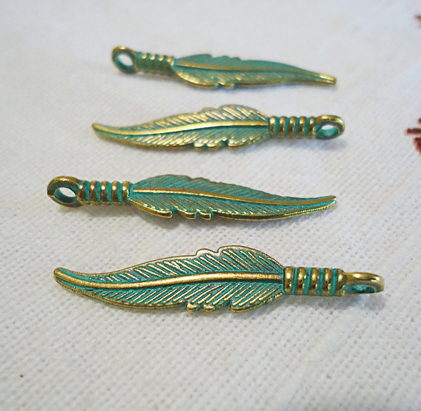 Feather Charms, Green Patina and Gold, 1.25" Long, Bulk Quantities